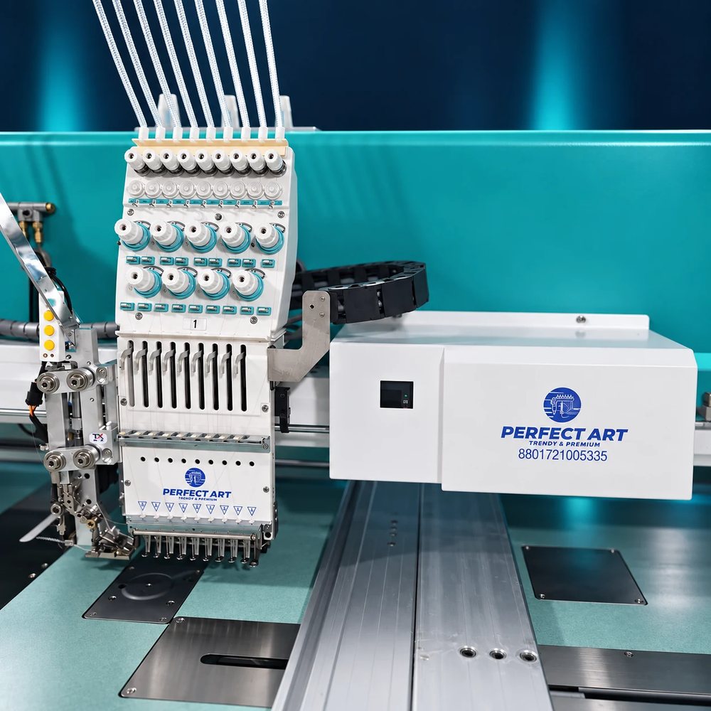 Perfect Art embroidery head with its control box and thread guides